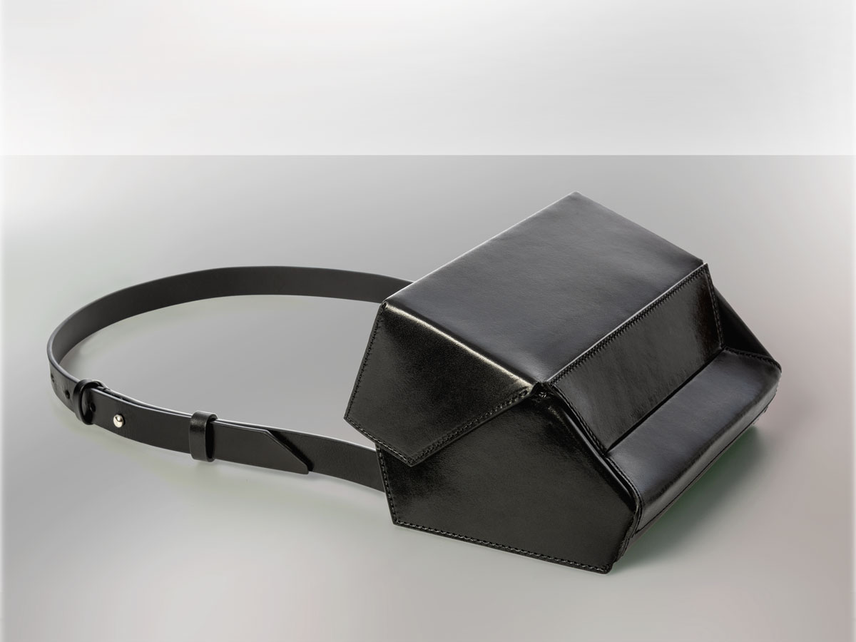 Merryl Tielman, Debby bag: a faceted shape that can be worn as a crossbody or belt bag. Made in Italy, vegetable tanned cow leather, colour black.